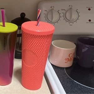 Pink studded Starbucks cup